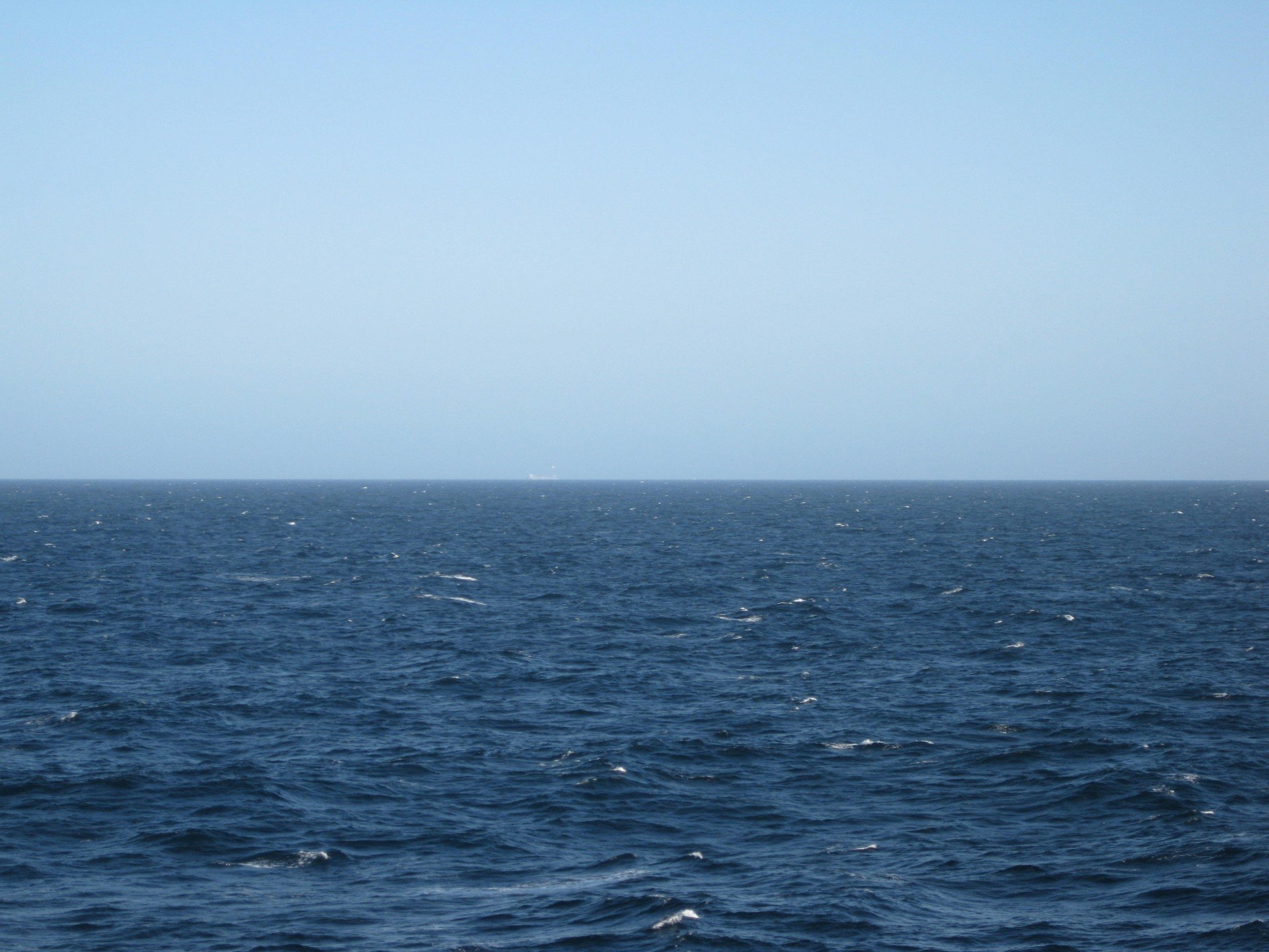 illustration photo: a dark blue ocean and a clear blue sky