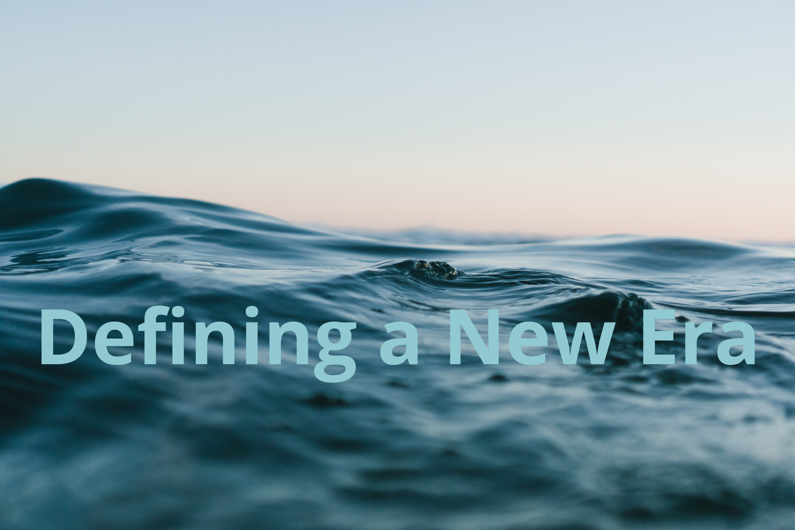 defining a new era, text with ocean and sky in the bakground 