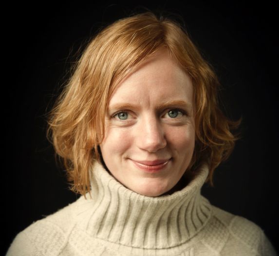 author Erika Fatland wearing a hvite turtle neck against a black background 