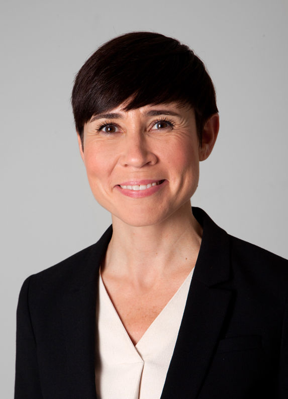 headshot of MP Ine Eriksen Søreide from the conservative party, wearing a white shirt and a black blazer