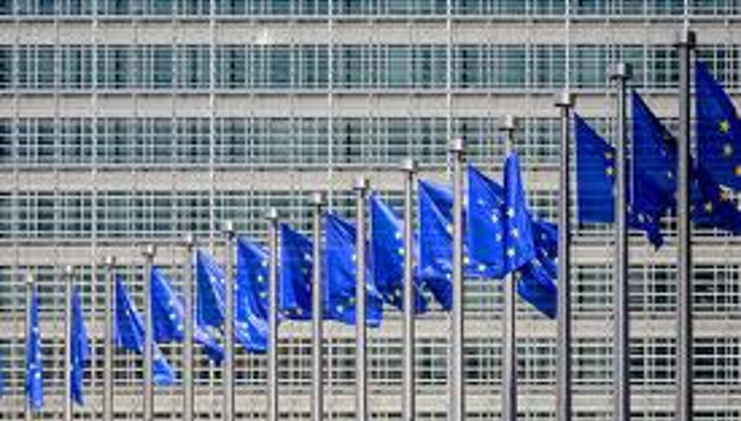 eu flags against a grey facade backdrop 