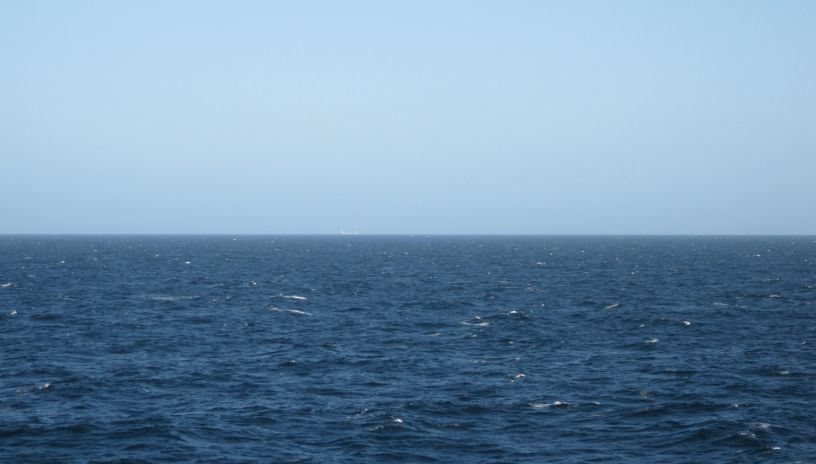 illustration photo: a dark blue ocean and a clear blue sky