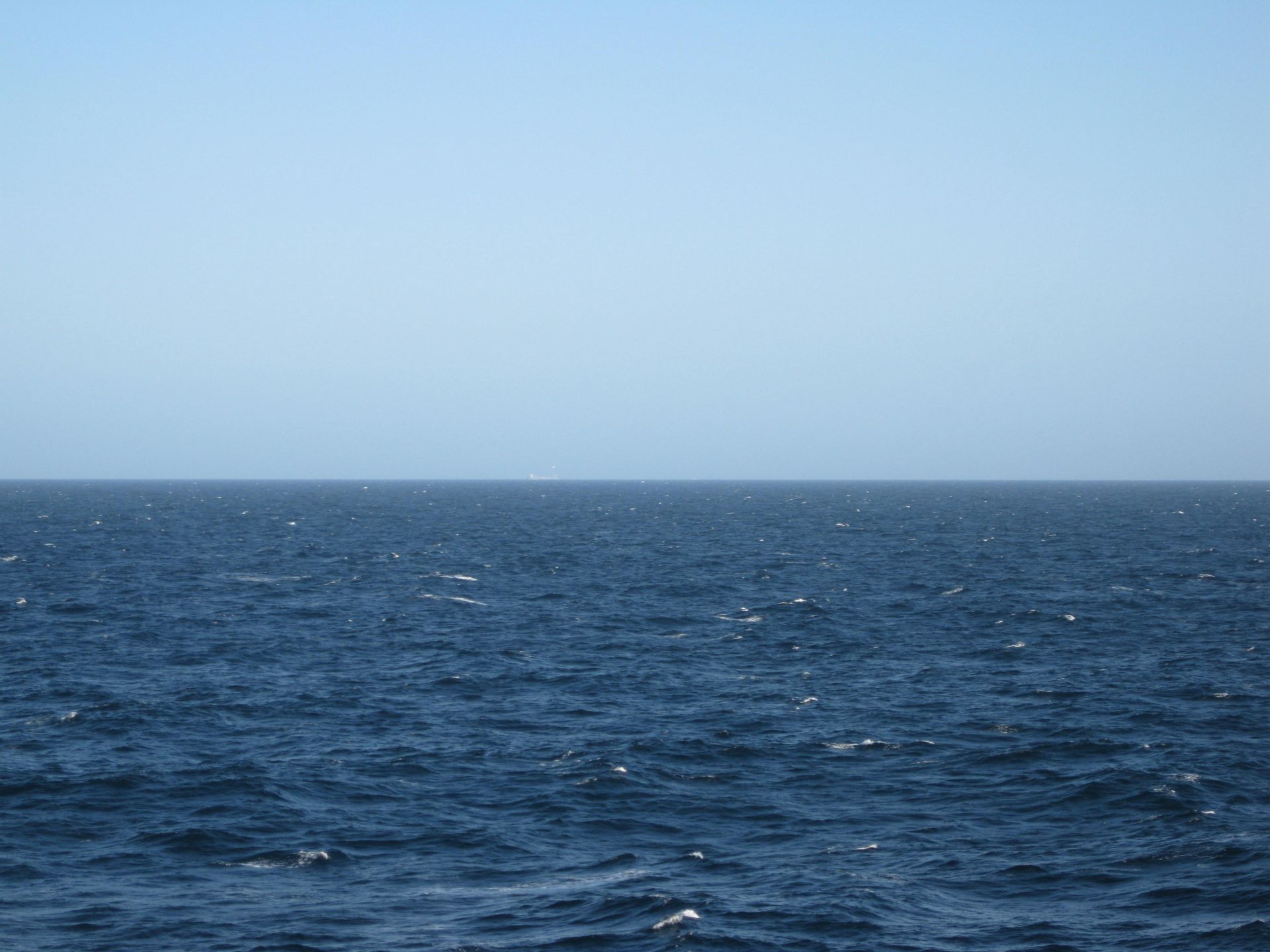 illustration photo: a dark blue ocean and a clear blue sky