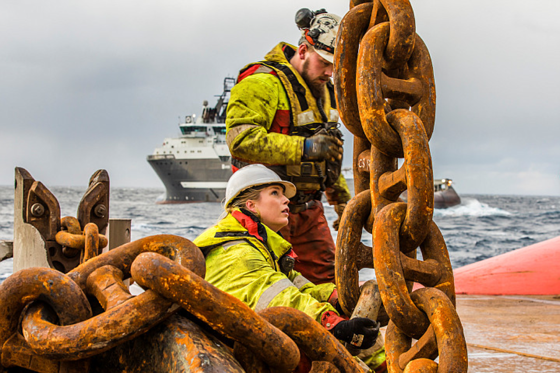 One male and one female working on the deck of an AHTS