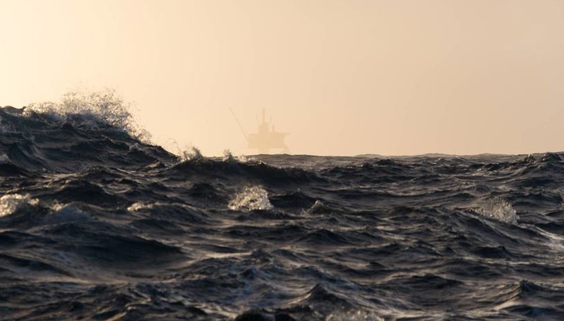 upet ocean and fog with a rig on the horizon 